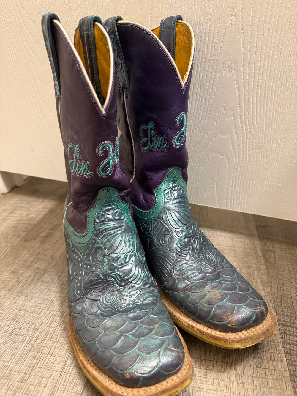 Tin Haul under the sea woman’s boots.